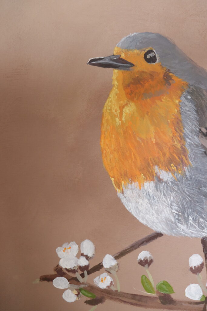 śliczny rudzik na gałązce